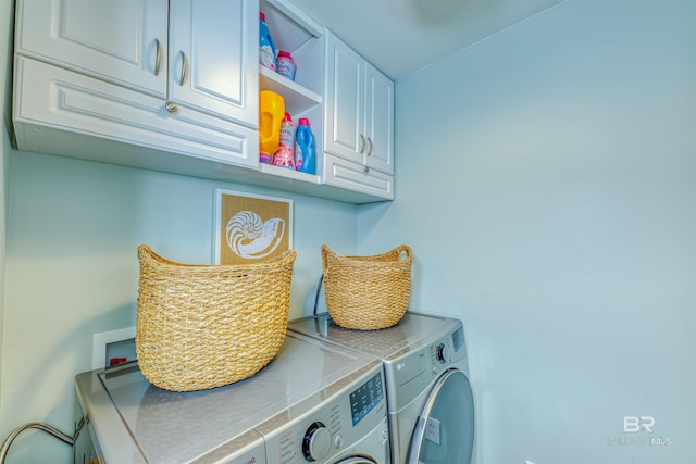 laundry area featuring cabinet space and independent washer and dryer