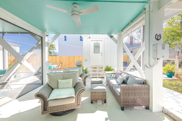 sunroom featuring a ceiling fan