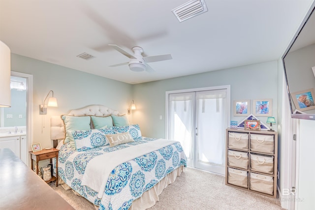 bedroom featuring carpet floors, access to exterior, visible vents, and a sink