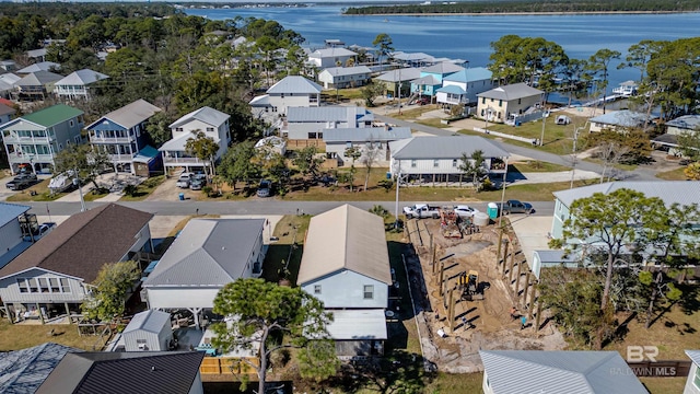 bird's eye view featuring a water view and a residential view