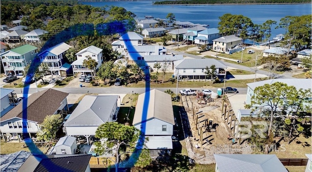 aerial view with a water view and a residential view