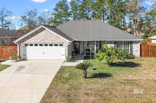 view of front of house featuring a front yard and a garage