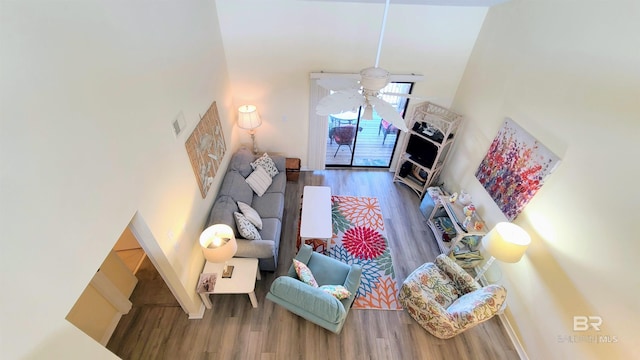 28835 Perdido Beach Blvd Unit 309, Orange Beach, AL 36561 - living area featuring wood finished floors, a towering ceiling, and ceiling fan