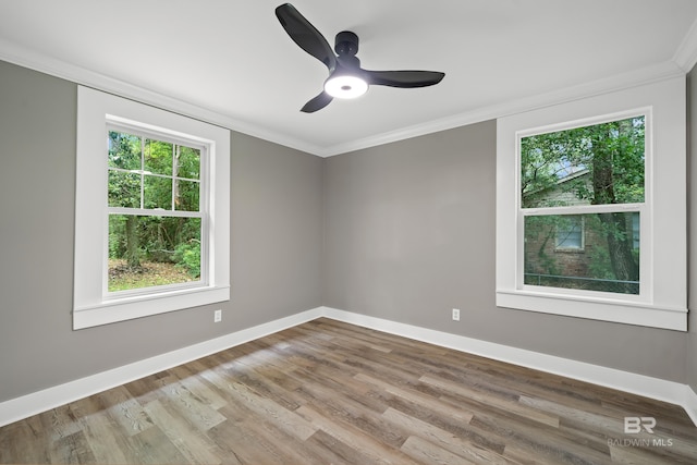 1716 Bryan Ave, Mobile, AL 36605 - empty room featuring crown molding, wood finished floors, baseboards, and a ceiling fan