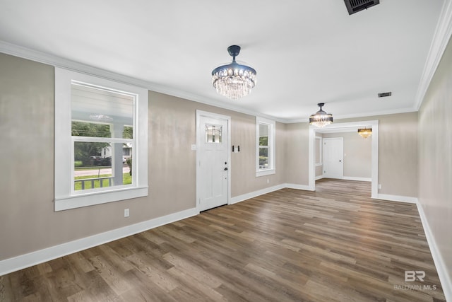 1716 Bryan Ave, Mobile, AL 36605 - entrance foyer with a chandelier, wood finished floors, ornamental molding, and baseboards