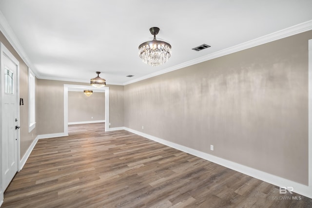 1716 Bryan Ave, Mobile, AL 36605 - spare room with a chandelier, wood finished floors, ornamental molding, and baseboards
