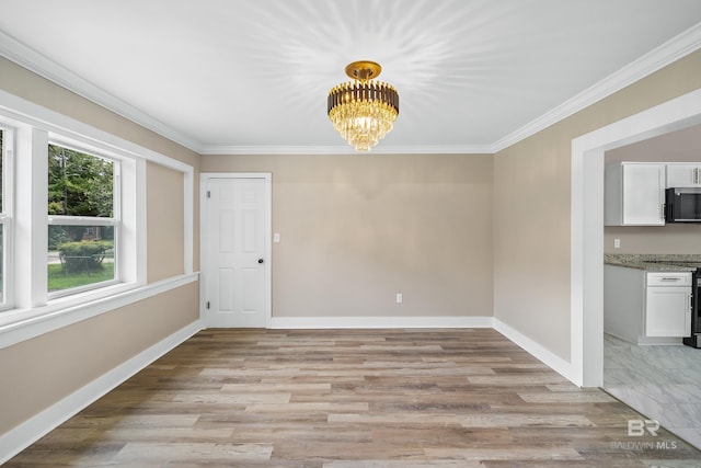 1716 Bryan Ave, Mobile, AL 36605 - unfurnished dining area with crown molding, a chandelier, light wood-style flooring, and baseboards