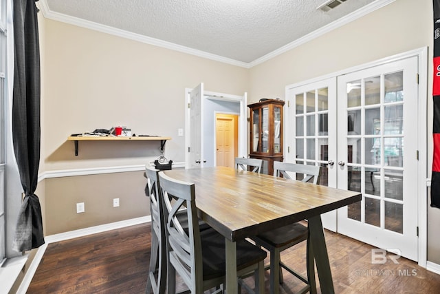 dining space with crown molding, french doors, and dark wood-type flooring