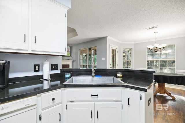 kitchen featuring sink, white cabinets, and white dishwasher