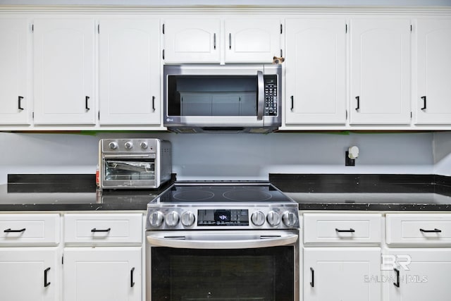 kitchen featuring appliances with stainless steel finishes and white cabinets