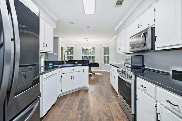 kitchen featuring sink, appliances with stainless steel finishes, and white cabinets