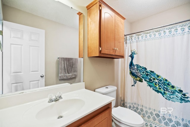 bathroom featuring a textured ceiling, toilet, vanity, and a shower with curtain