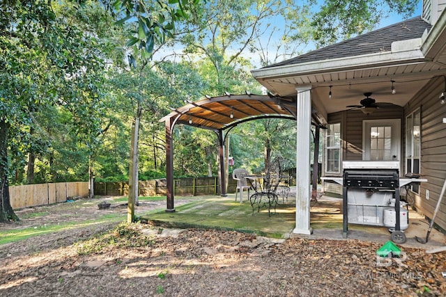 view of yard with a patio and ceiling fan