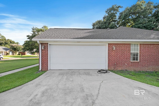 garage with a lawn