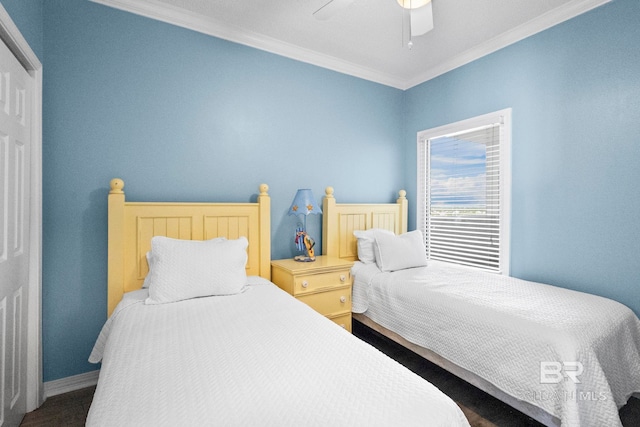 bedroom featuring baseboards, a ceiling fan, and crown molding