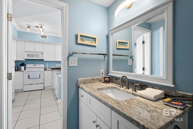 bathroom featuring a textured ceiling, vanity, visible vents, ornamental molding, and tile patterned floors