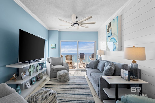 tiled living room with ornamental molding, a textured ceiling, and a ceiling fan