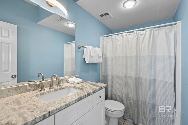 full bath with visible vents, vanity, and toilet