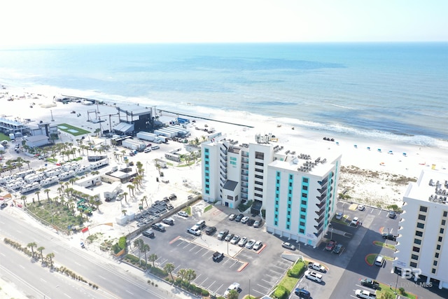 birds eye view of property featuring a water view and a view of the beach