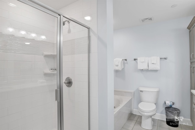bathroom with tile patterned floors, toilet, a bath, a stall shower, and baseboards