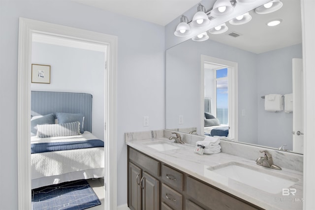 full bathroom with connected bathroom and double vanity