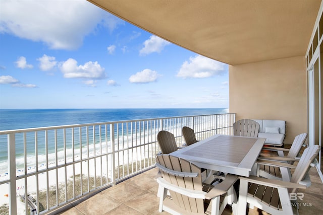 balcony featuring view of water and beach