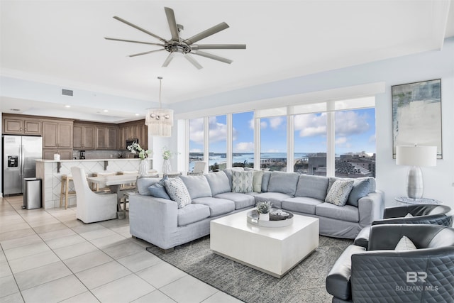 living room featuring light tile patterned floors, ceiling fan, and recessed lighting
