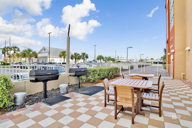view of patio featuring a grill and outdoor dining area