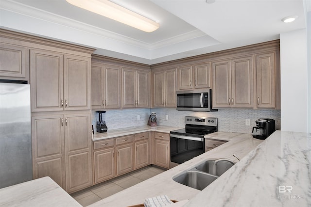 kitchen with stainless steel appliances, a sink, light stone counters, tasteful backsplash, and light tile patterned floors