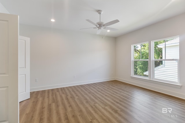 9264 Brighton Ave, Elberta, AL 36530 - empty room with light wood finished floors, ceiling fan, baseboards, and recessed lighting