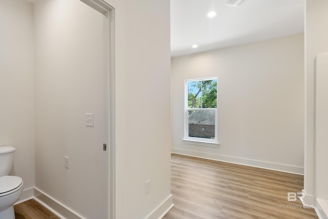9264 Brighton Ave, Elberta, AL 36530 - bathroom featuring toilet, wood finished floors, baseboards, and recessed lighting