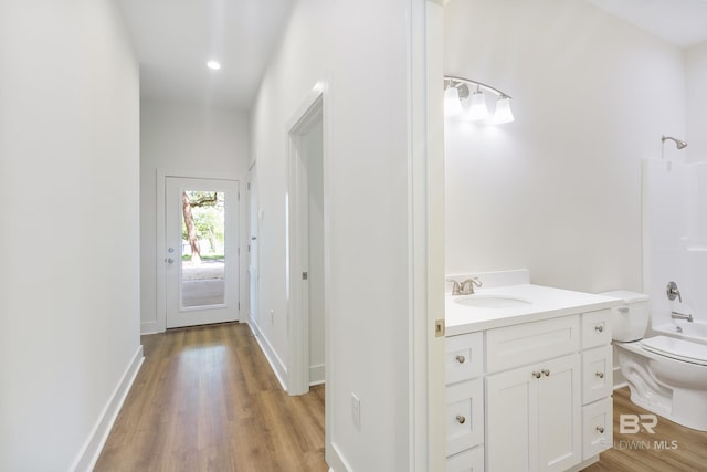 9264 Brighton Ave, Elberta, AL 36530 - hallway featuring a sink, light wood finished floors, and recessed lighting