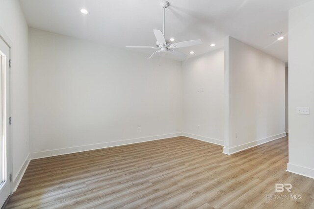 9264 Brighton Ave, Elberta, AL 36530 - empty room with light wood finished floors, ceiling fan, recessed lighting, and baseboards