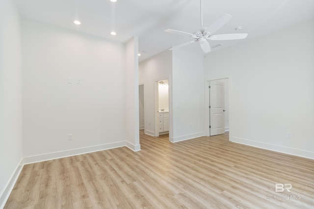 9264 Brighton Ave, Elberta, AL 36530 - unfurnished room with light wood-style flooring, baseboards, ceiling fan, recessed lighting, and a high ceiling