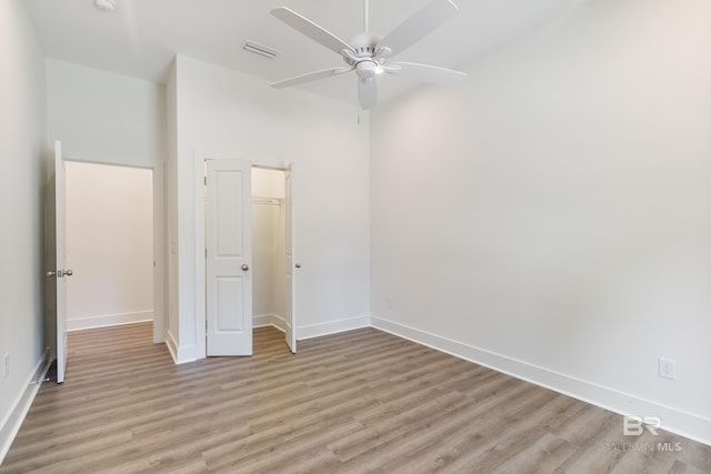 9264 Brighton Ave, Elberta, AL 36530 - unfurnished bedroom featuring light wood-type flooring, baseboards, a closet, and ceiling fan