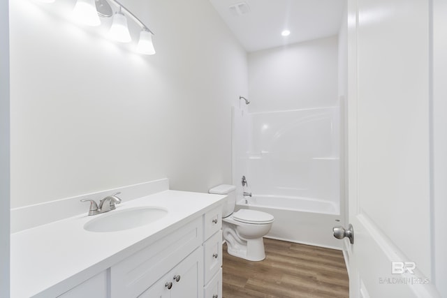 9264 Brighton Ave, Elberta, AL 36530 - bathroom featuring toilet, vanity, wood finished floors, and shower / tub combination