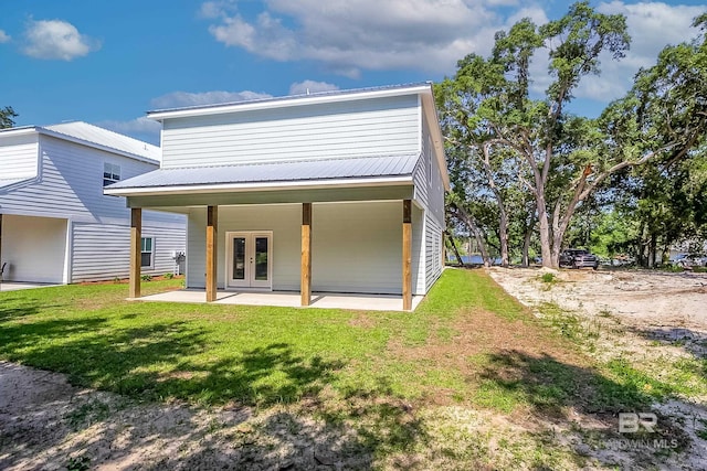 9264 Brighton Ave, Elberta, AL 36530 - rear view of property featuring french doors, a yard, a patio area, and metal roof