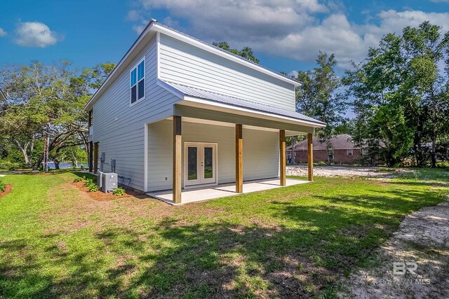 9264 Brighton Ave, Elberta, AL 36530 - back of house with french doors, a patio area, and a lawn