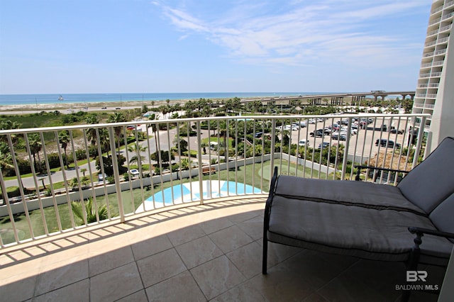 balcony featuring a water view