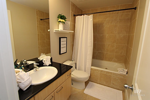 full bathroom with shower / tub combo with curtain, tile floors, toilet, and vanity with extensive cabinet space