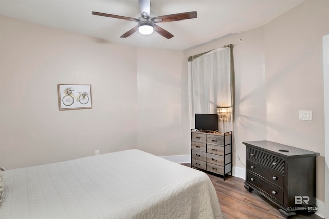 bedroom featuring hardwood / wood-style floors and ceiling fan