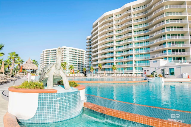 view of pool with pool water feature