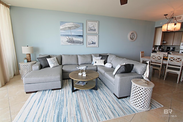 living room featuring light tile floors