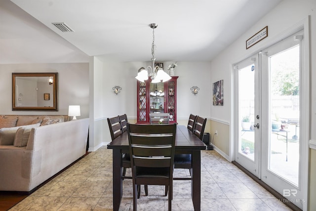 1500 Thames Dr, Foley, AL 36535 - dining space featuring a chandelier, visible vents, french doors, and a healthy amount of sunlight