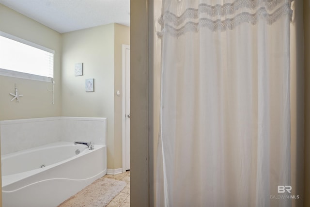 1500 Thames Dr, Foley, AL 36535 - full bath with tile patterned floors, baseboards, and a garden tub