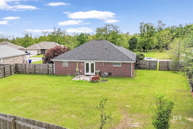 1500 Thames Dr, Foley, AL 36535 - back of property featuring a patio, french doors, a fenced backyard, and a lawn