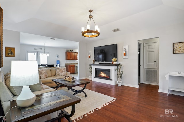 1500 Thames Dr, Foley, AL 36535 - living area featuring a notable chandelier, baseboards, visible vents, and wood finished floors