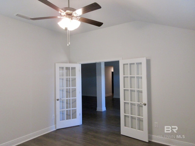 spare room with ceiling fan, french doors, dark hardwood / wood-style floors, and lofted ceiling