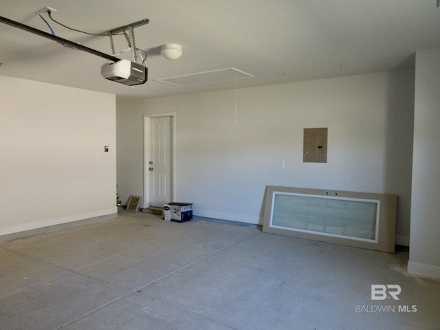 garage featuring electric panel and a garage door opener