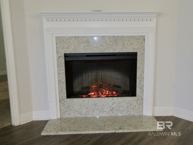 details with hardwood / wood-style floors and a high end fireplace